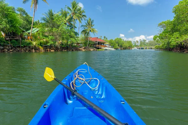 Nose of canoe floating behind rower on a river — Stock Photo, Image