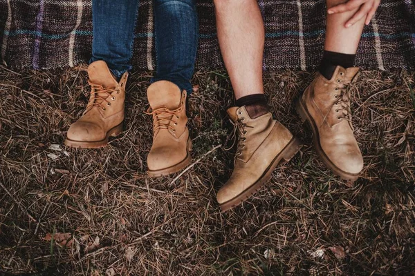 Walking with a pair of timberland boots — Stock Photo, Image