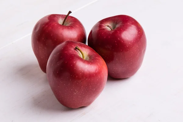 Red apple on white table — Stock Photo, Image