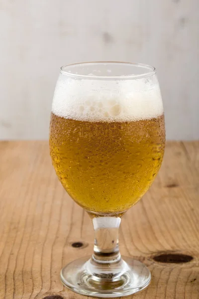 Beer on wooden table — Stock Photo, Image