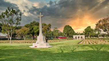 Kanchanaburi, Thailand 12.28.2019: Kanchanaburi War Cemetery or Don-Rak War Cemetery is the main prisoner of war (POW) cemetery for victims of Japanese imprisonment while building the Burma Railway. clipart