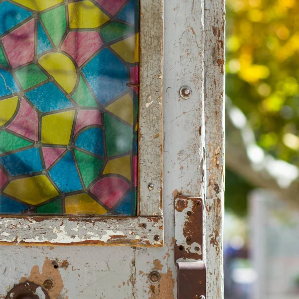 old door with colourful stained glass. Vintage door