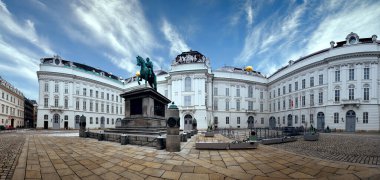 Austrian National Library in Vienna, statue of Kaiser Joseph II in front of the building, panoramic toned image. clipart