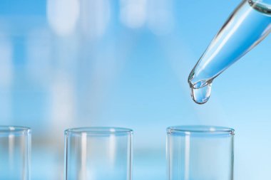 Bilimsel arkaplan: bir tüpe düşen pipetten düşme, metin alanı 