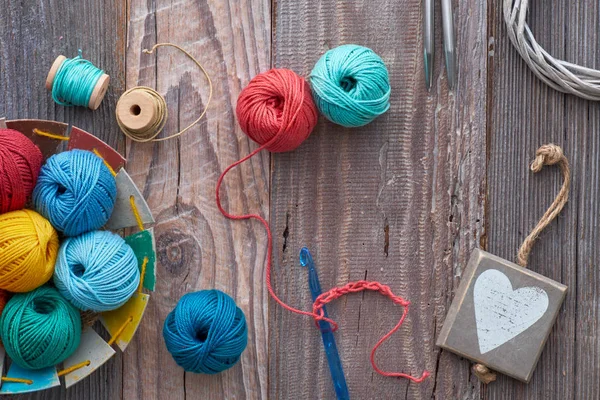 Crochet, top view on yarn balls on wood — стокове фото