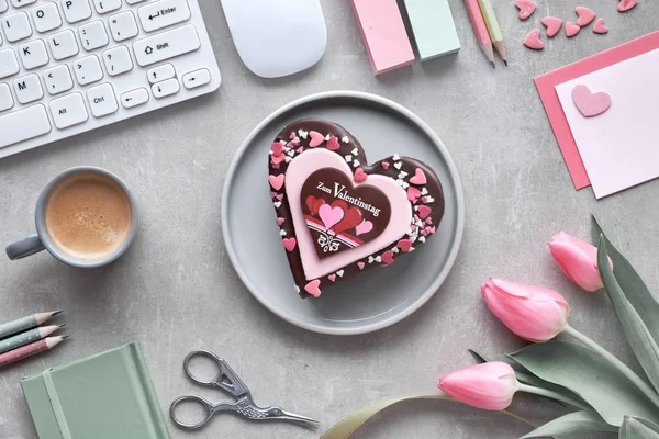 Valentine heart cake on table top with keyboard, coffee, cards a — ストック写真