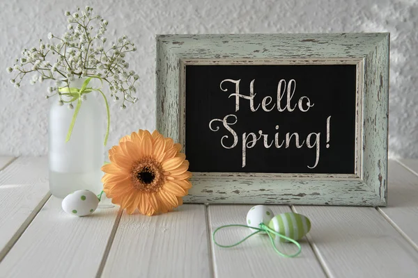 Spring flowers, Easter decorations and a blackboard on white tab — Stock Photo, Image