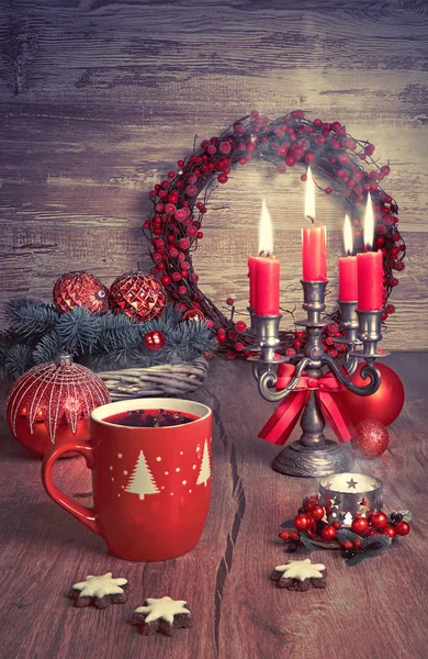 Mulled wine, Christmas cookies and candles on decorated table — ストック写真