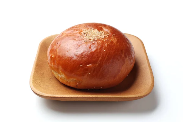 Anpan round bread with azuki red beans paste isolated on plate on white background — Stok fotoğraf