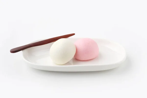 Kouhaku manjyu Japanese traditional confectionery cake wagashi on plate isolated on white background — Zdjęcie stockowe