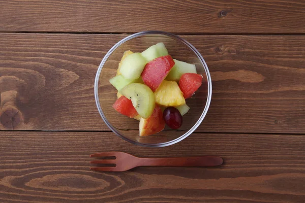 Fresh fruit dessert on wooden table — Stock Photo, Image