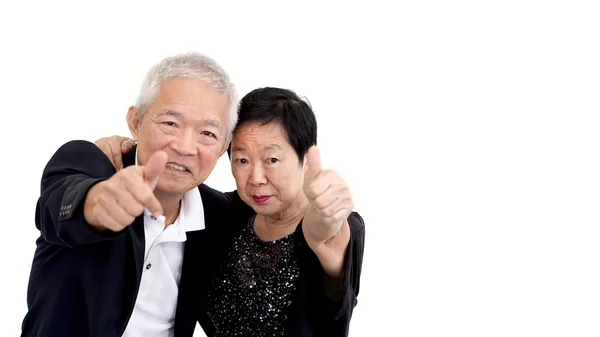 Asian senior couple in business attire showing hand gesture thumb up — Stock Photo, Image