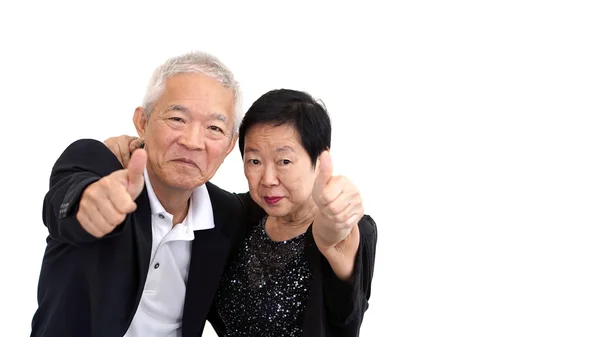 Asiático casal sênior no negócio traje mostrando mão gesto polegar para cima — Fotografia de Stock