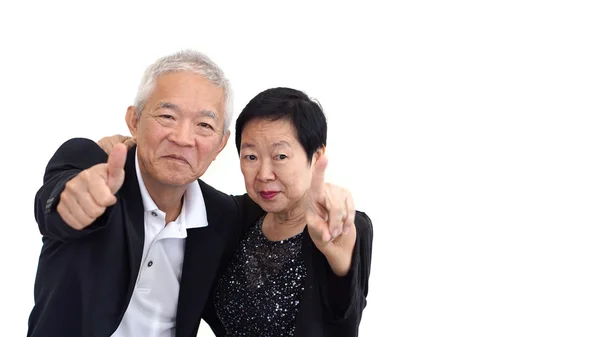 Asiatico anziano coppia in affari abbigliamento mostrando mano gesto pollice su e indicando — Foto Stock
