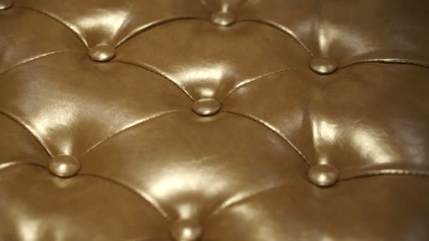 Brown leather Chesterfield sofa seats close up shot detail and texture — Stock Video