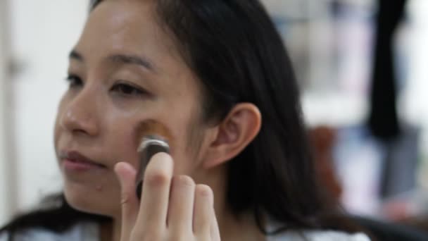Asian woman doing pink brush on cheek. Model, cosmetic and beauty concept slow motion — Stock Video