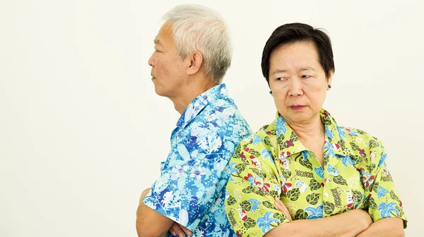 Asian senior couple unhappy, fighting. Relationship problem on white background — Stock Photo, Image