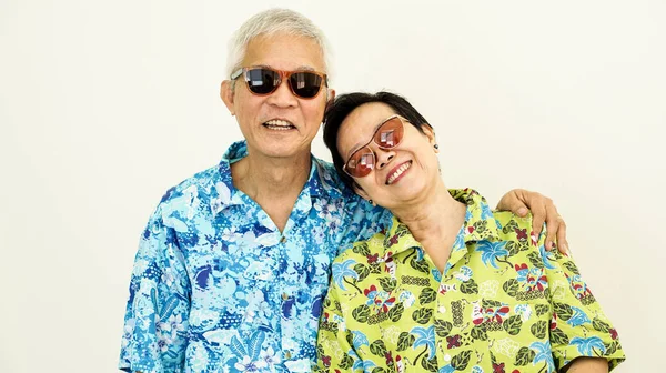 Happy Asain senior couple ready to travel for holiday on white b — Stock Photo, Image