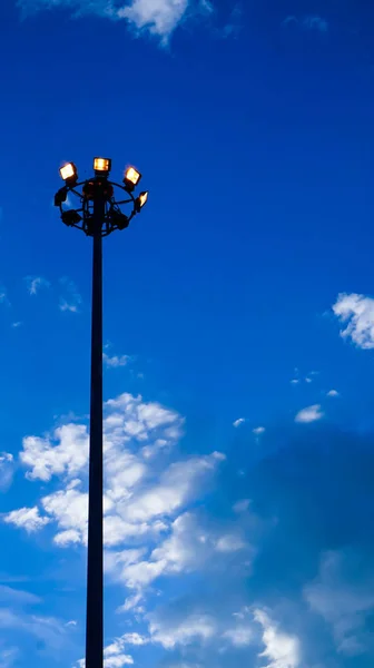 Light pole of  floodlight on evening dusk sky background — Stock Photo, Image