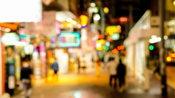 Rozmazání záběru neon nakupování podepisuje rozostření pozadí Hong Kong — Stock fotografie