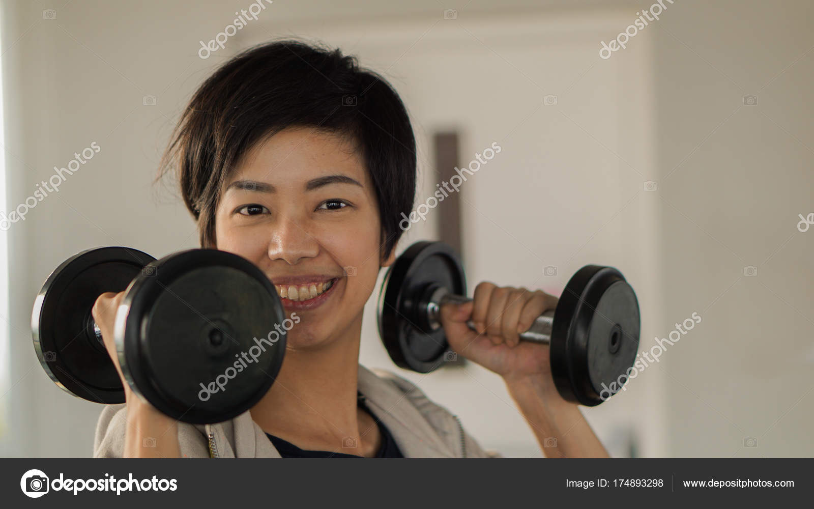 Smiling Asian Short Hair Woman Fitness Dumbbell Lifting Exercise