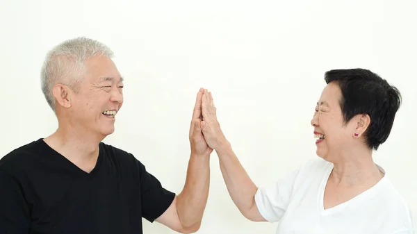 Asian senior couple smile, life with no worry on white backgroun