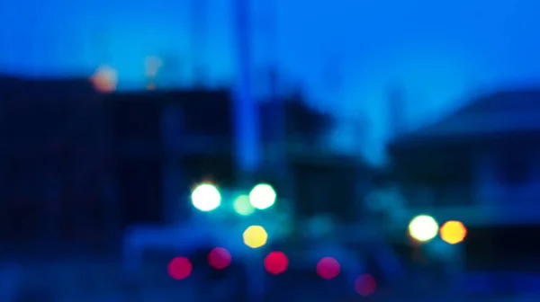 Blur construction crane truck working on structure at night — Stock Photo, Image