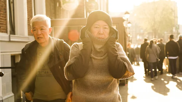 Asian senior couple walking in Europe tried trip in morning sunl — Stock Photo, Image