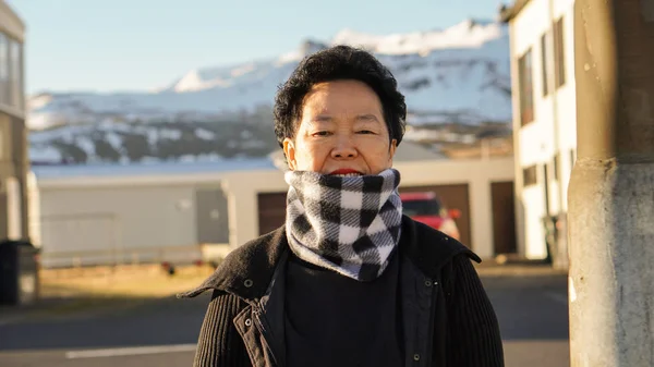 Asian senior woman portrait in Europe snow mountain village mori — Stock Photo, Image