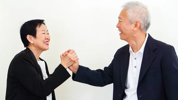 Asian senior business people couple holding hand for successful — Stock Photo, Image