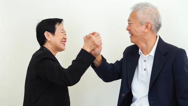Asian senior business people couple holding hand for successful — Stock Photo, Image