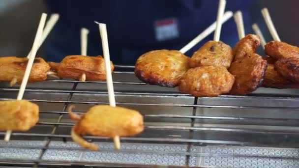 Hands Grilling Squid Balls Electric Grill Japanese Market — Stock Video