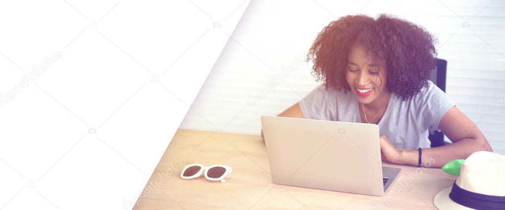 African woman working with laptop from home serious entrepreneur