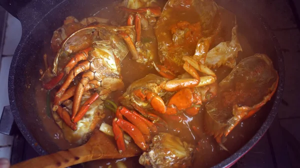 Chef cooking Chili Crab Singapore Chinese cuisine iconic dish