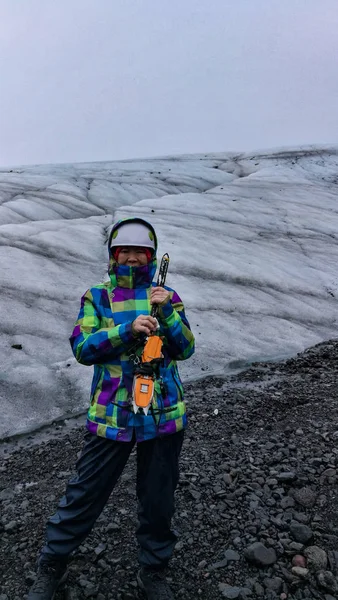 Asian old senior woman hiking on glacier volcanic landscape in I — Stock Photo, Image