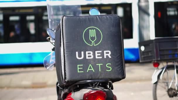 Amsterdam Netherland 4 Apr 2017 Uber Eats on motorcycle famous food delivery app — Stock Video