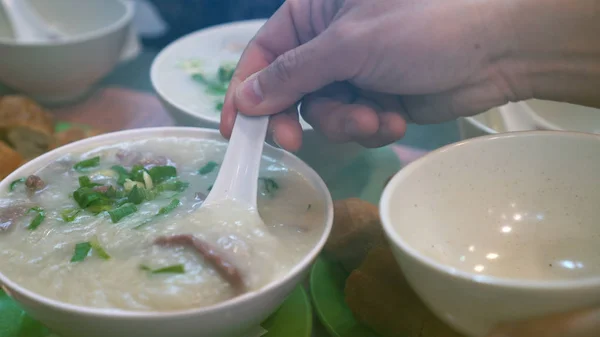 Cantonese congee boiled rice pork soup morning hot meal — Stock Photo, Image