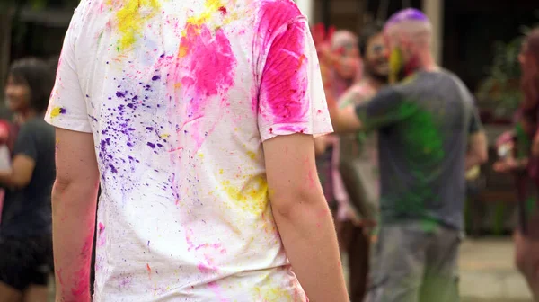 India colorful Holi festival abstract color powder on white shirt of girl back side