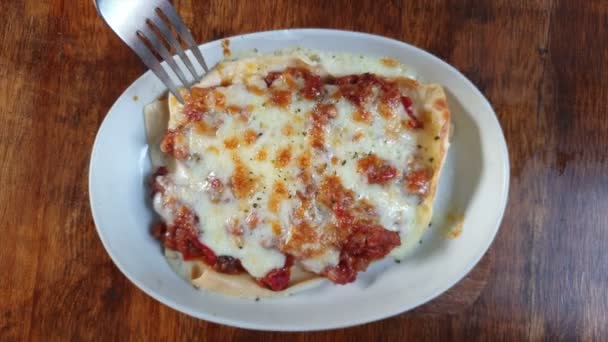 Family Sharing Lasagna Wood Table Top View — Stock Video