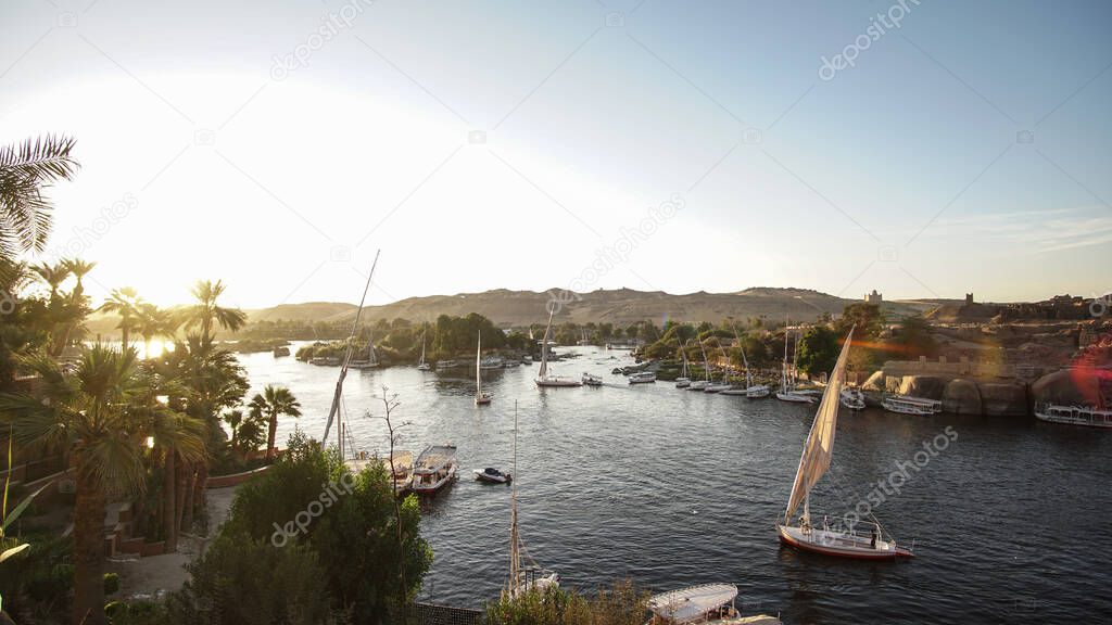 Nile river bank landscape view at sunset Aswan Egypt leisure scenic activity