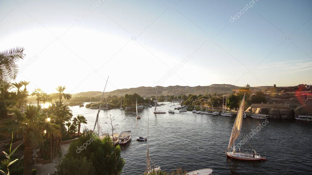 Nile river bank landscape view at sunset Aswan Egypt leisure scenic activity