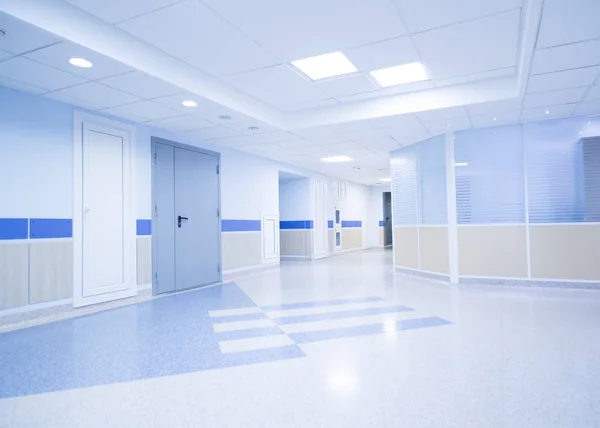 Hospital corridor with seats and wheelchairs — Stock Photo, Image