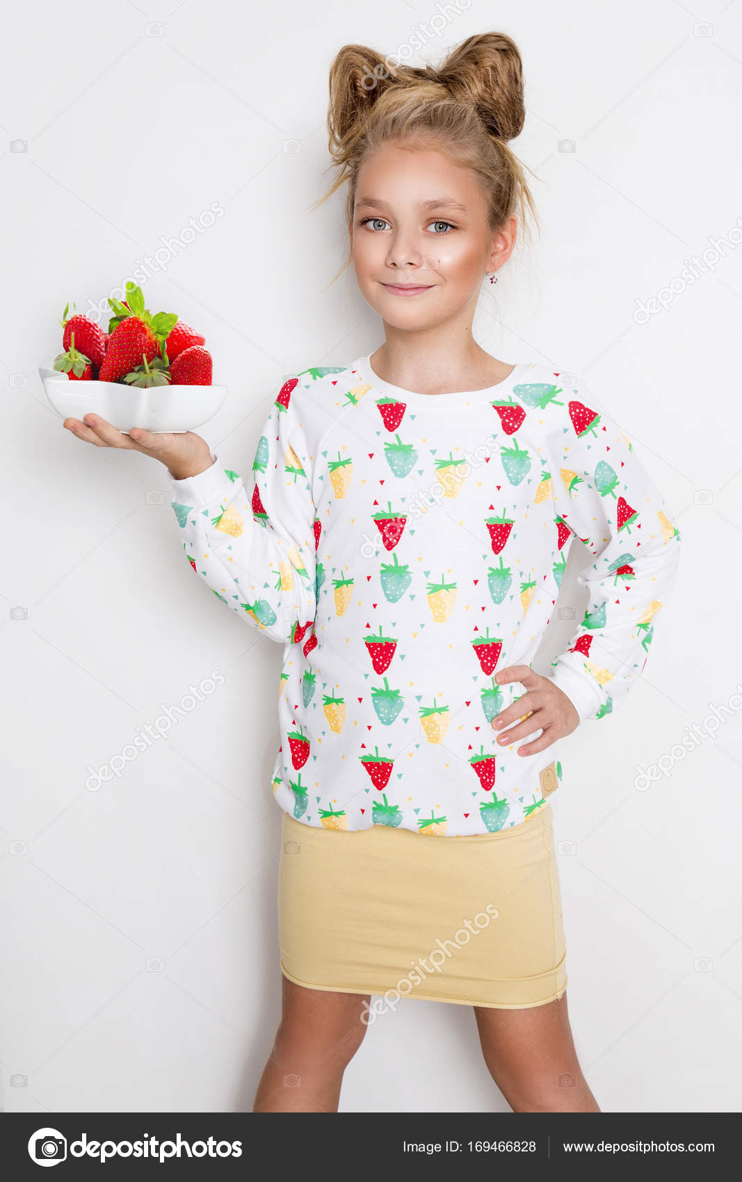 Gracious Little Girl With Blond Hair And Blue Eyes Standing On A