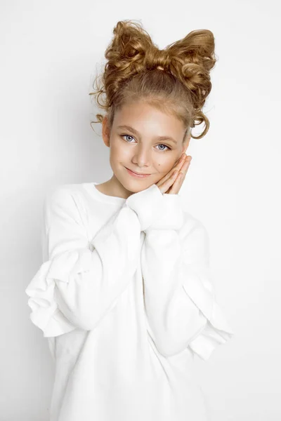 Cute, beautiful blonde young girl with bow from hair. Beauty and joyful girl. — Stock Photo, Image