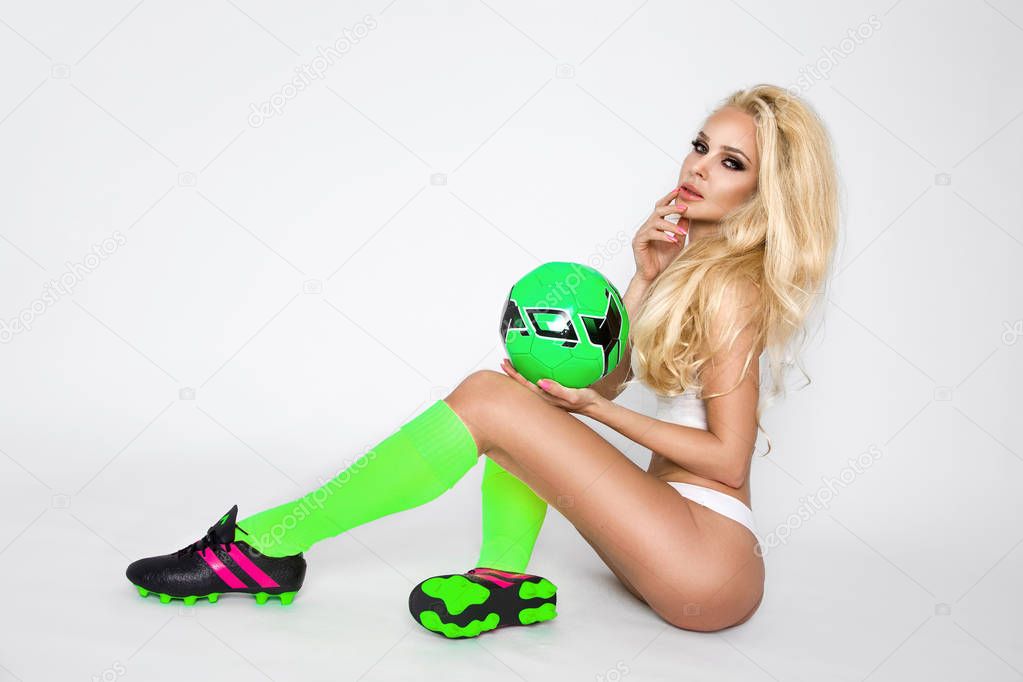Beautiful young athletic girl blonde woman dressed in sports att