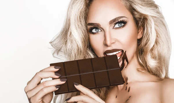 Portrait Satisfied Pretty Girl Biting Chocolate Bar Looking Camera Isolated — Stock Photo, Image