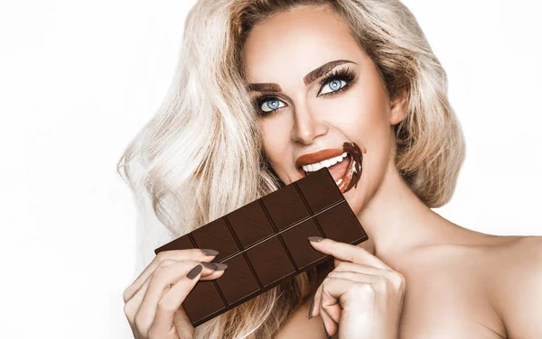 Portrait Satisfied Pretty Girl Biting Chocolate Bar Looking Camera Isolated — Stock Photo, Image
