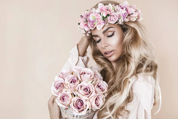 Spring concept. Beautiful natural woman in wreath with flowers . Spring makeup girl portrait. Beauty portrait of female face with natural skin. Spring fashion photo. Skin care concept, beauty spa, bio product.