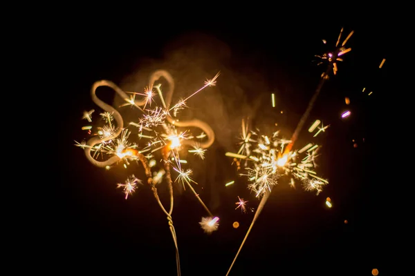 Sparkles in the dark. Celebration concept. Happy New Year Royalty Free Stock Images