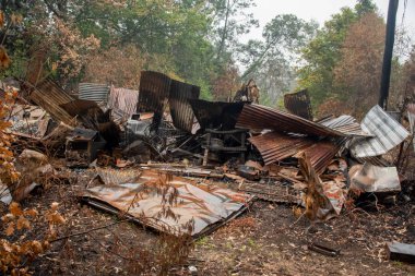 Australian bushfire aftermath: Burnt building ruins and rubble at Blue Mountains, Australia clipart